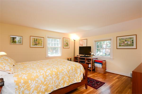 107 Viscount Road Longmeadow, MA 01106 - Photo 19 of 30 a bedroom with a bed and a flat screen tv