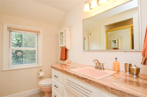 107 Viscount Road Longmeadow, MA 01106 - Photo 24 of 30 a bathroom with a granite countertop sink mirror vanity and a toilet