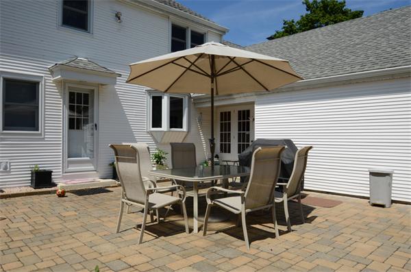 107 Viscount Road Longmeadow, MA 01106 - Photo 28 of 30 a patio with table and chairs and a barbeque