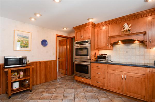 107 Viscount Road Longmeadow, MA 01106 - Photo 9 of 30 a kitchen with stainless steel appliances granite countertop a refrigerator and a stove top oven