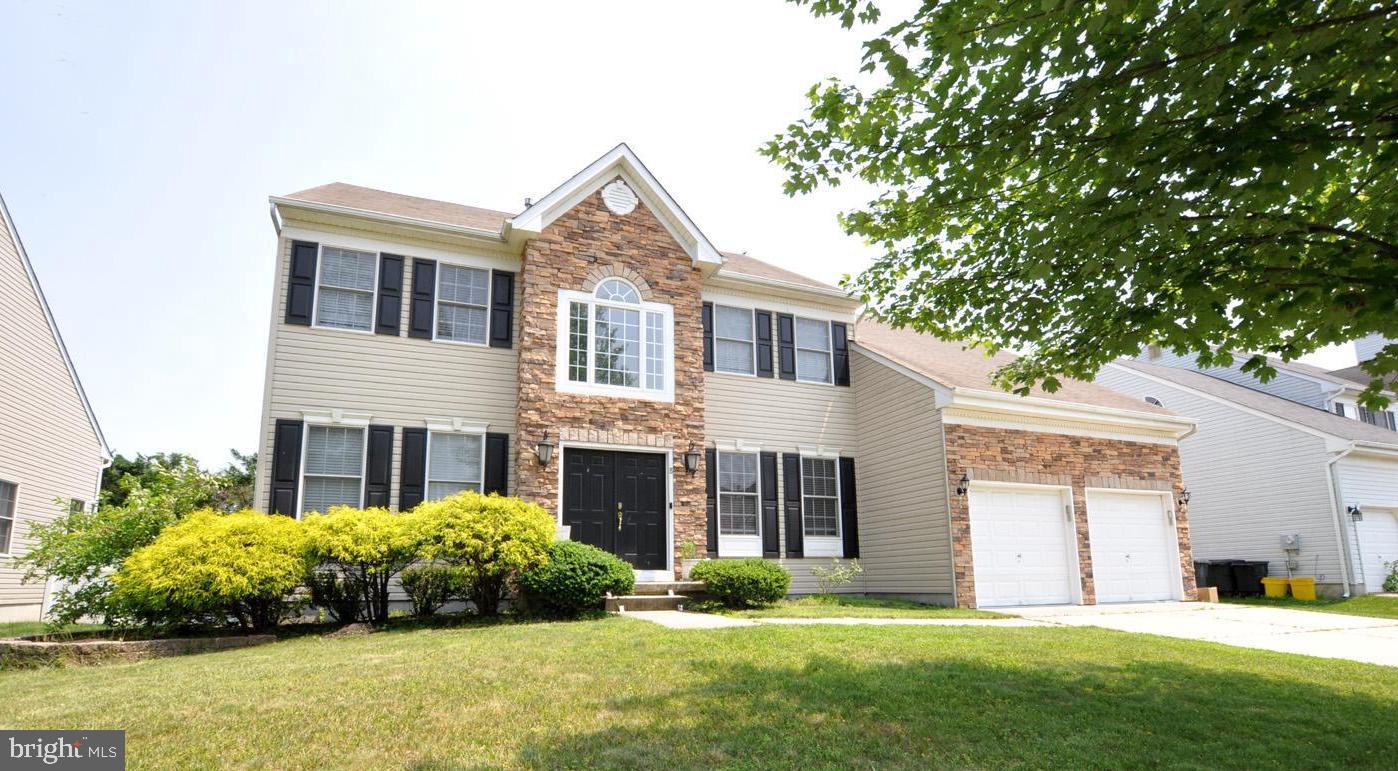 8 Jasmine Way Sewell, NJ 08080 - Photo 1 of 38 a front view of a house with a yard and garage