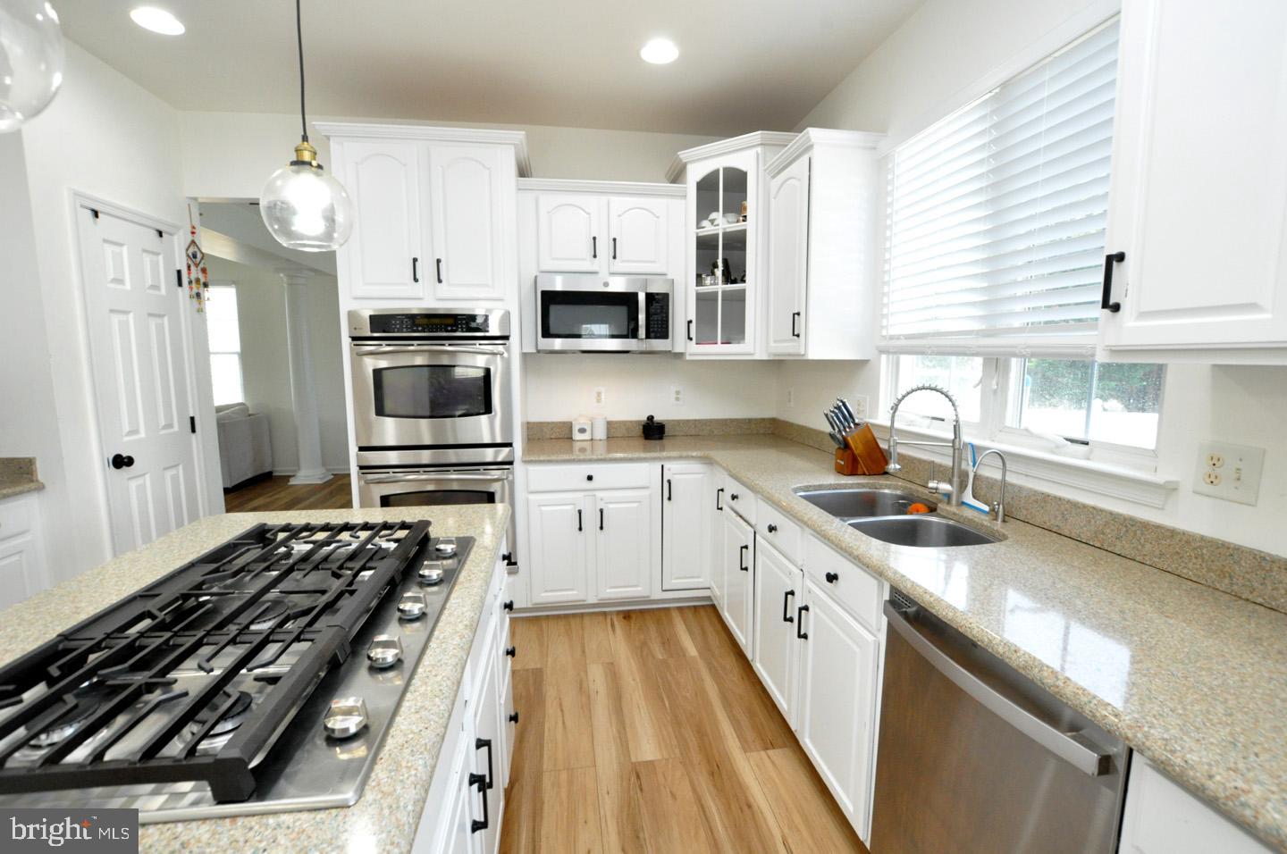 8 Jasmine Way Sewell, NJ 08080 - Photo 15 of 38 a kitchen with stainless steel appliances a stove a sink and a refrigerator