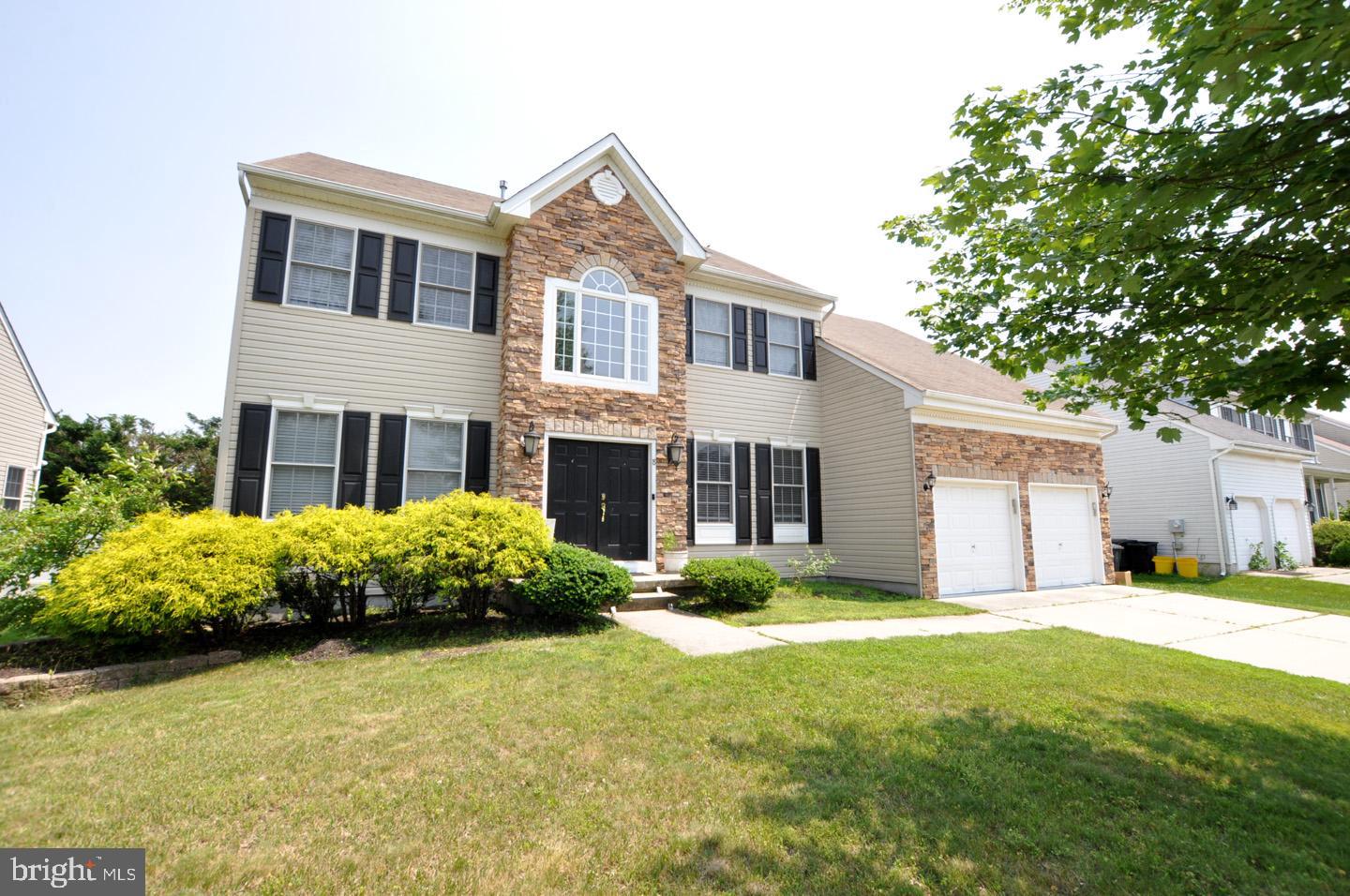 8 Jasmine Way Sewell, NJ 08080 - Photo 2 of 38 a front view of a house with garden