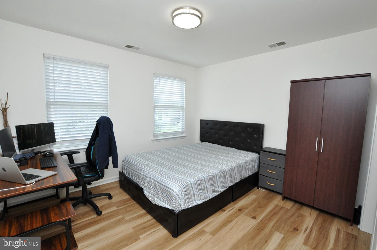 8 Jasmine Way Sewell, NJ 08080 - Photo 25 of 38 a bedroom with a bed and a desk