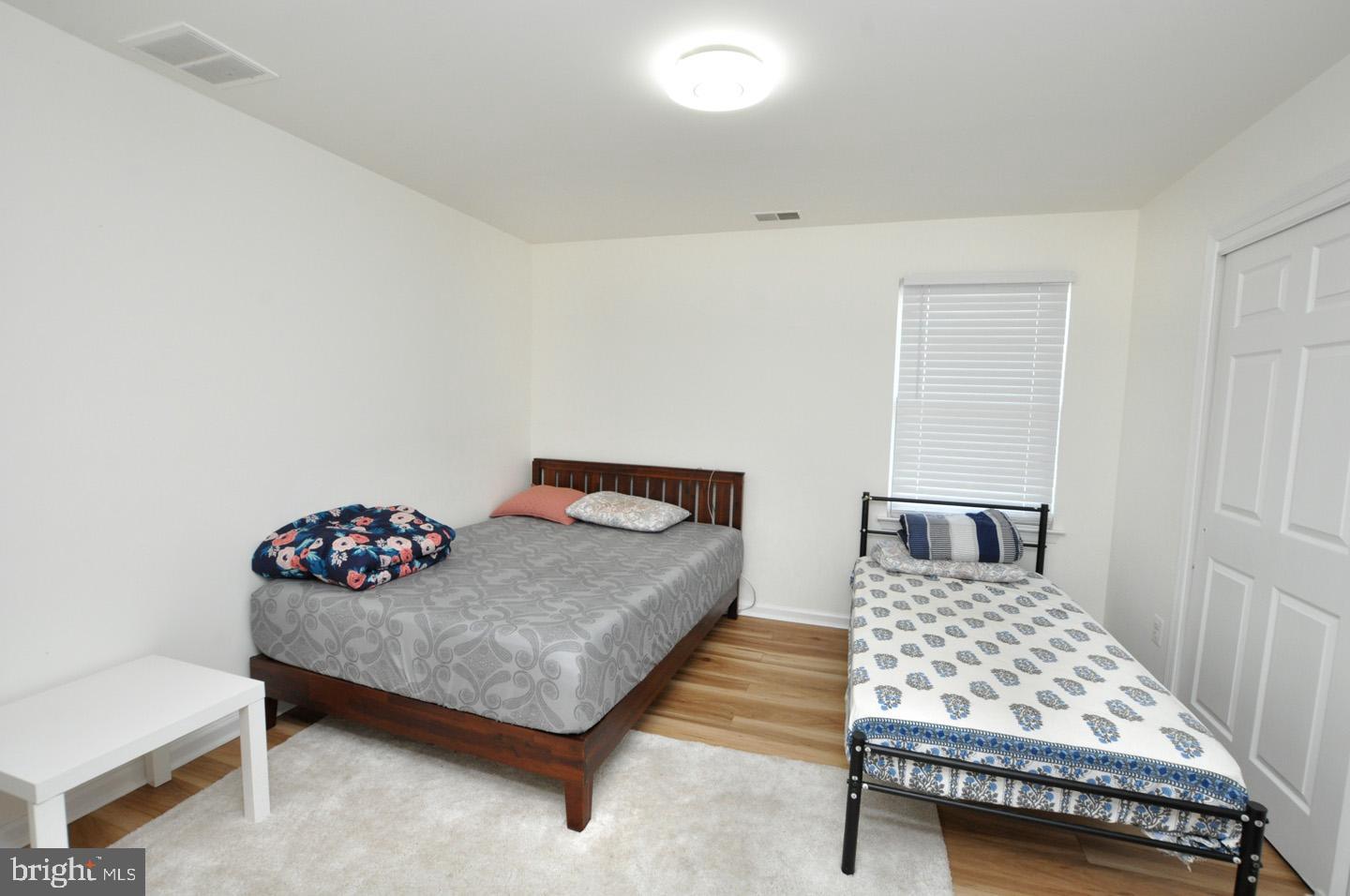 8 Jasmine Way Sewell, NJ 08080 - Photo 26 of 38 a bedroom with a bed and a table