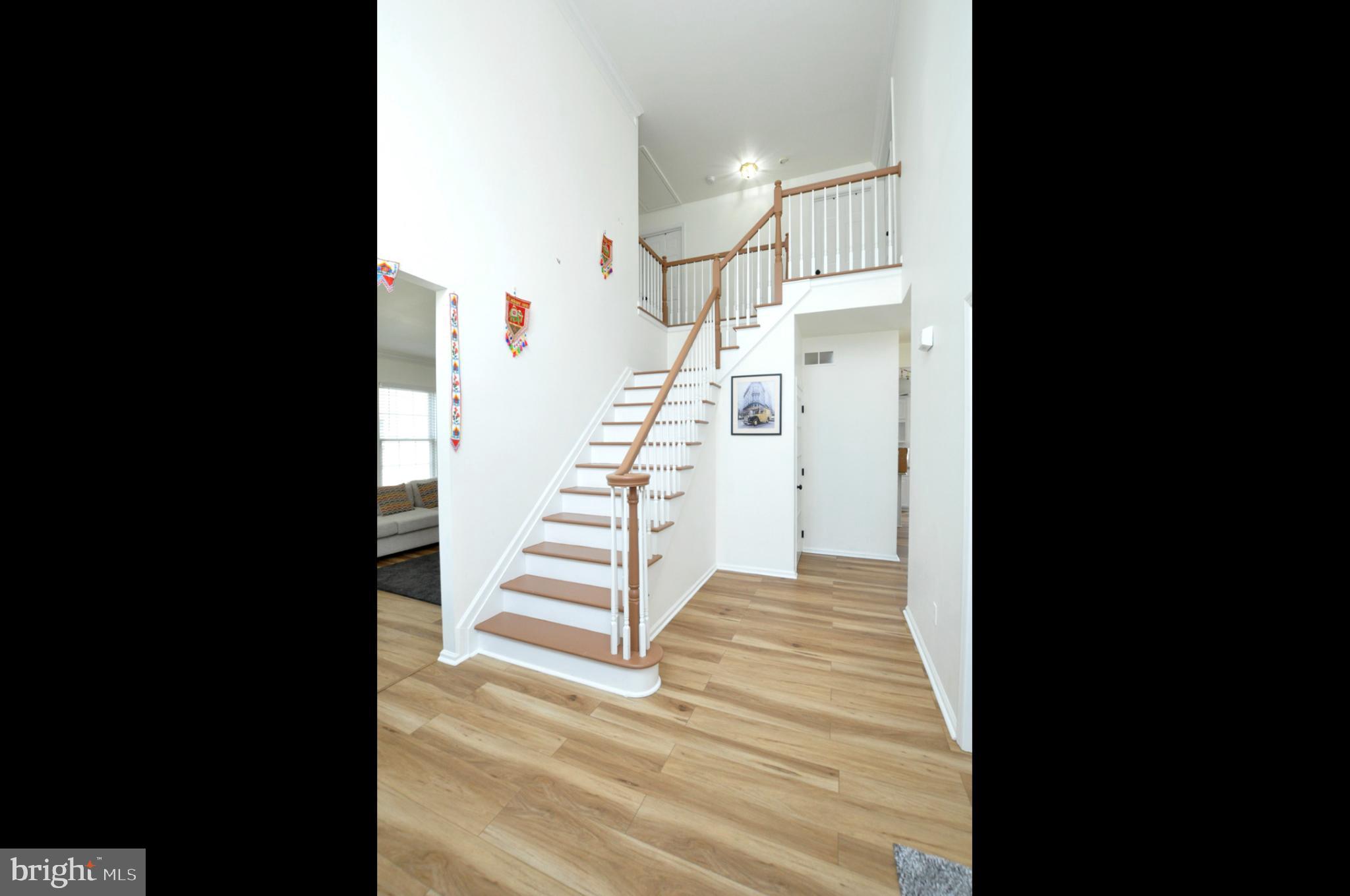 8 Jasmine Way Sewell, NJ 08080 - Photo 5 of 38 a view of entryway and hall with wooden floor