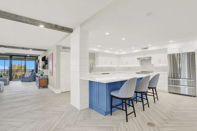 a kitchen with a table and chairs in it