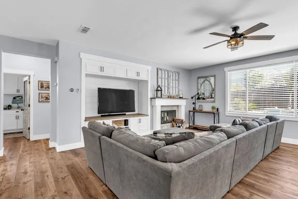 a living room with furniture and a large window