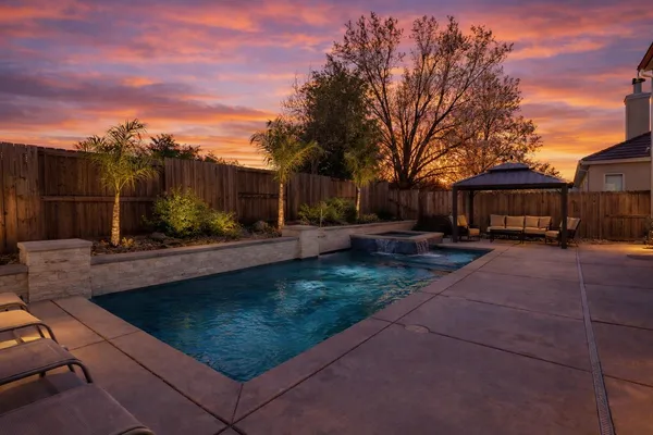 a view of a swimming pool with a patio