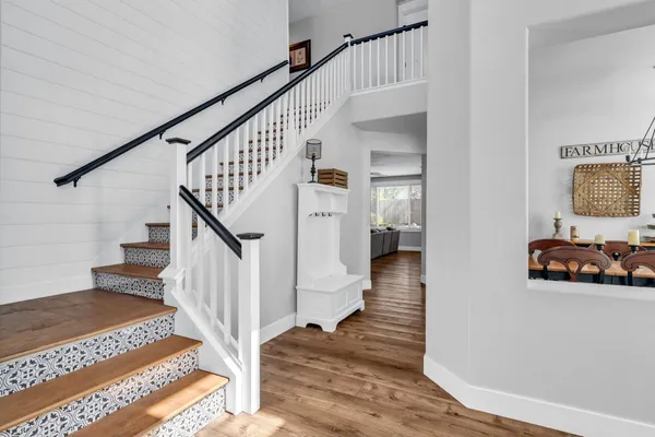 a living room with furniture a fireplace and a table