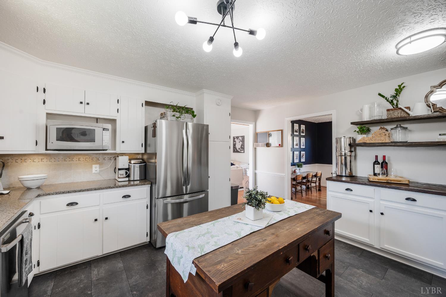1199 Great Oak Road Forest, VA 24551 - Photo 27 of 85 a kitchen with granite countertop a refrigerator stove top oven and sink