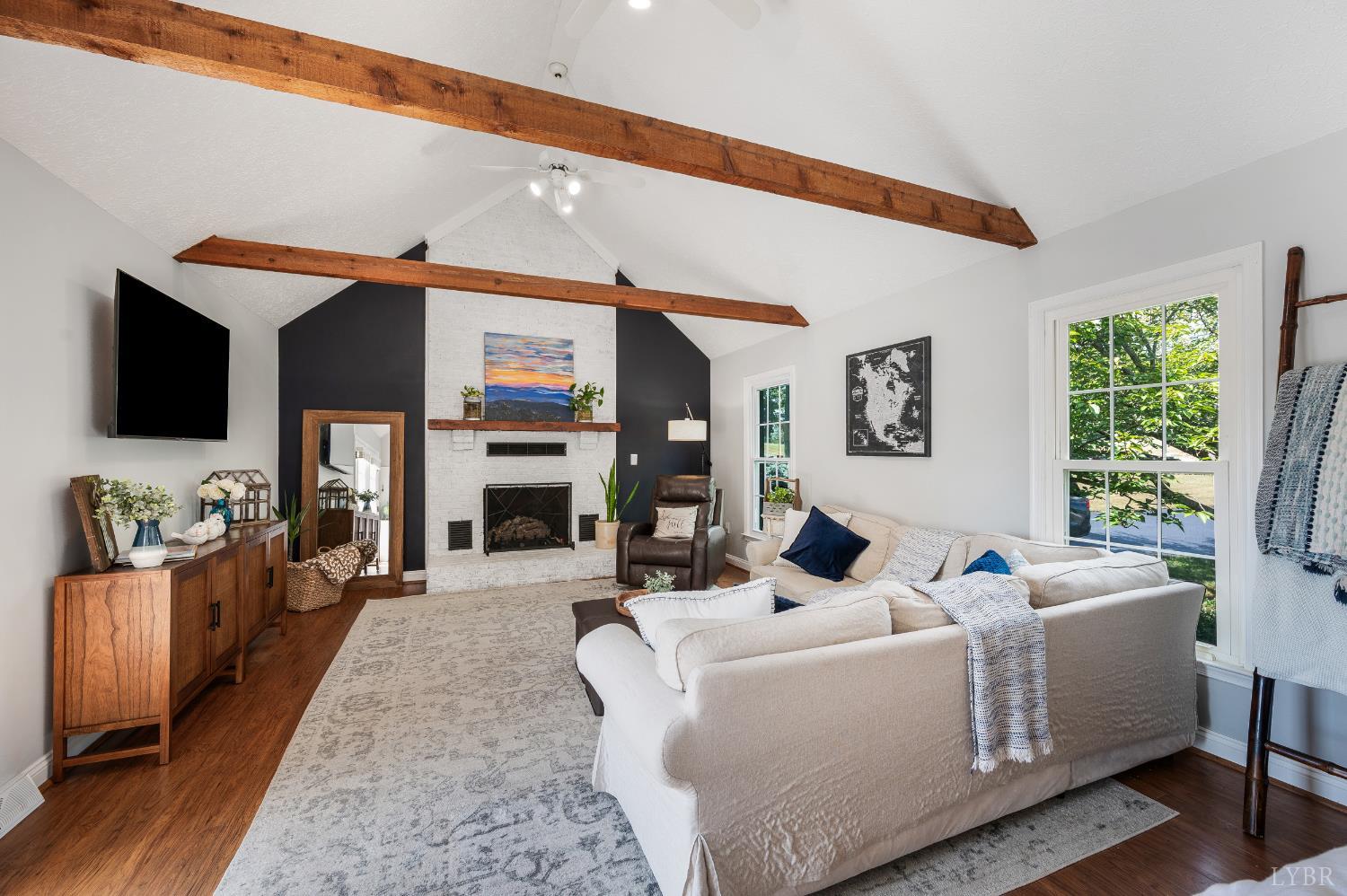 1199 Great Oak Road Forest, VA 24551 - Photo 28 of 85 a living room with furniture a flat screen tv and a fireplace