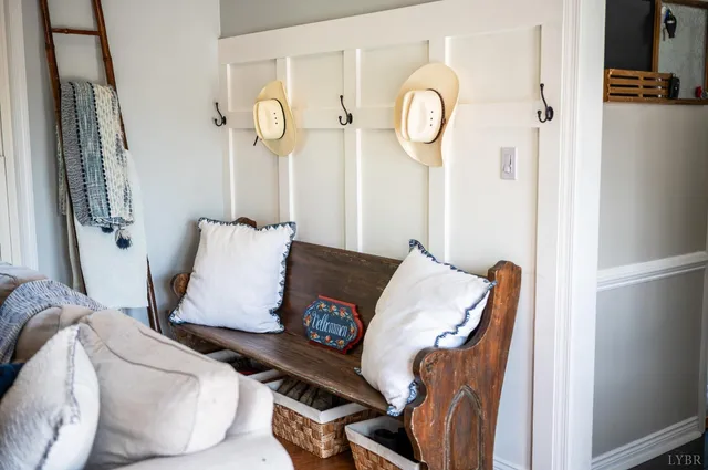 a view of a deck with furniture and a barbeque