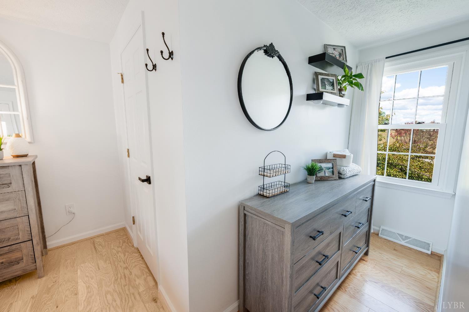 1199 Great Oak Road Forest, VA 24551 - Photo 39 of 85 a bathroom with a granite countertop sink a mirror and a window