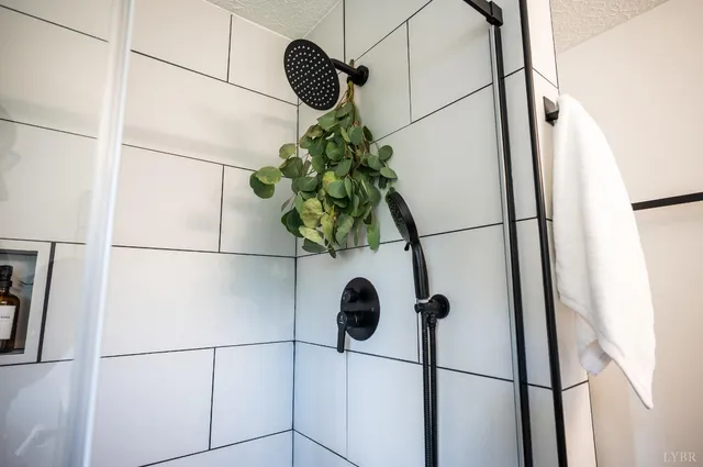 a view of a swimming pool with a patio and a yard