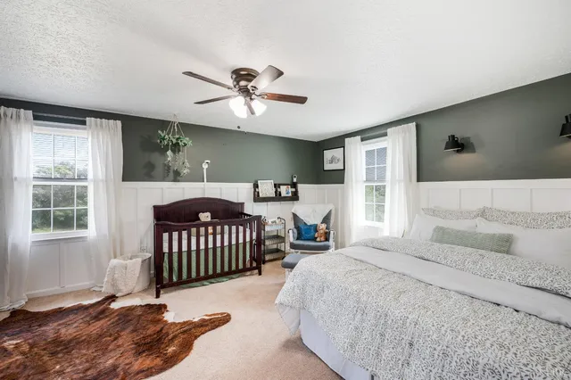 a bathroom with a shower and a mirror