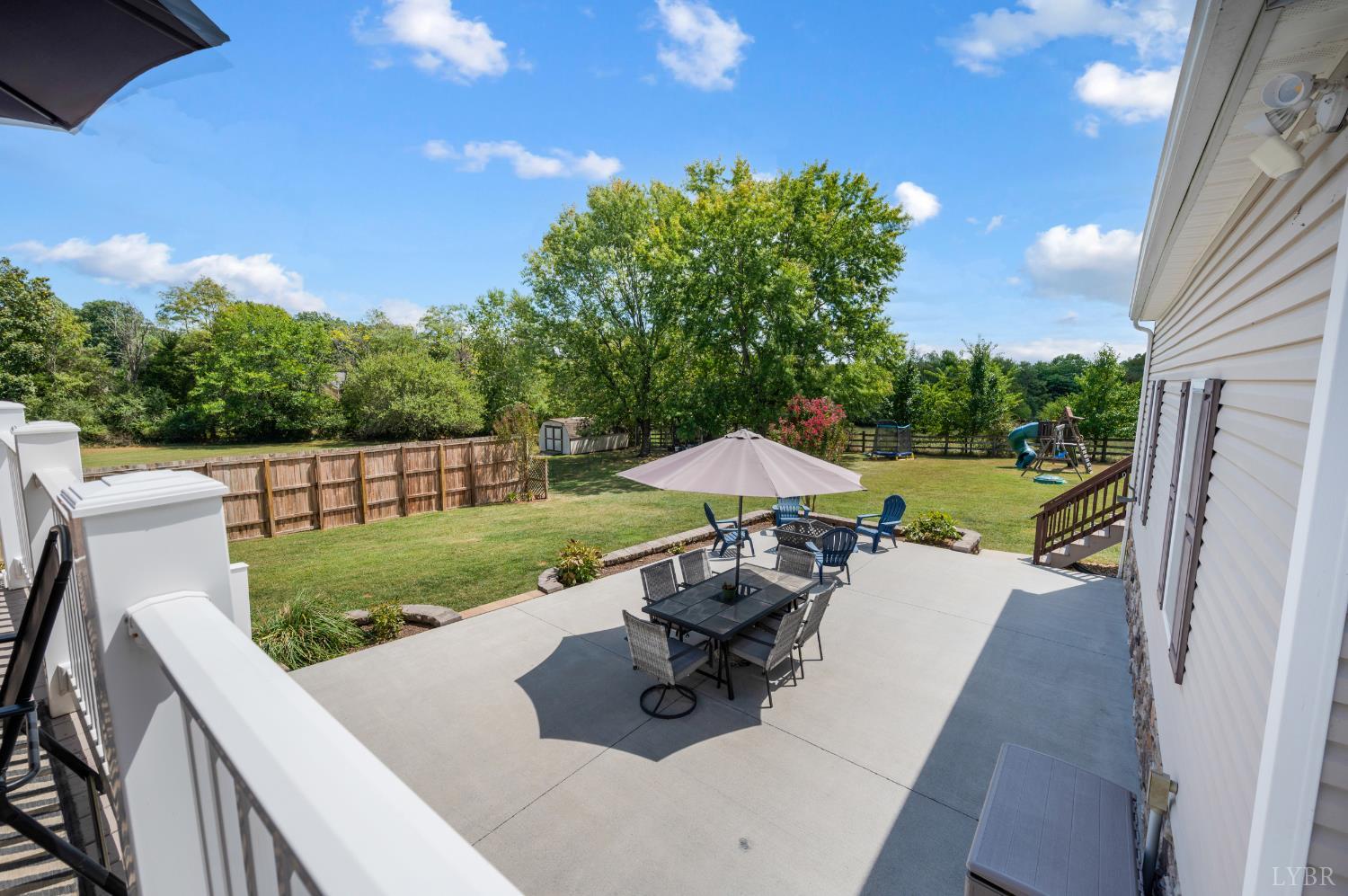1199 Great Oak Road Forest, VA 24551 - Photo 55 of 85 a view of a patio with table and chairs potted plants with floor to ceiling window