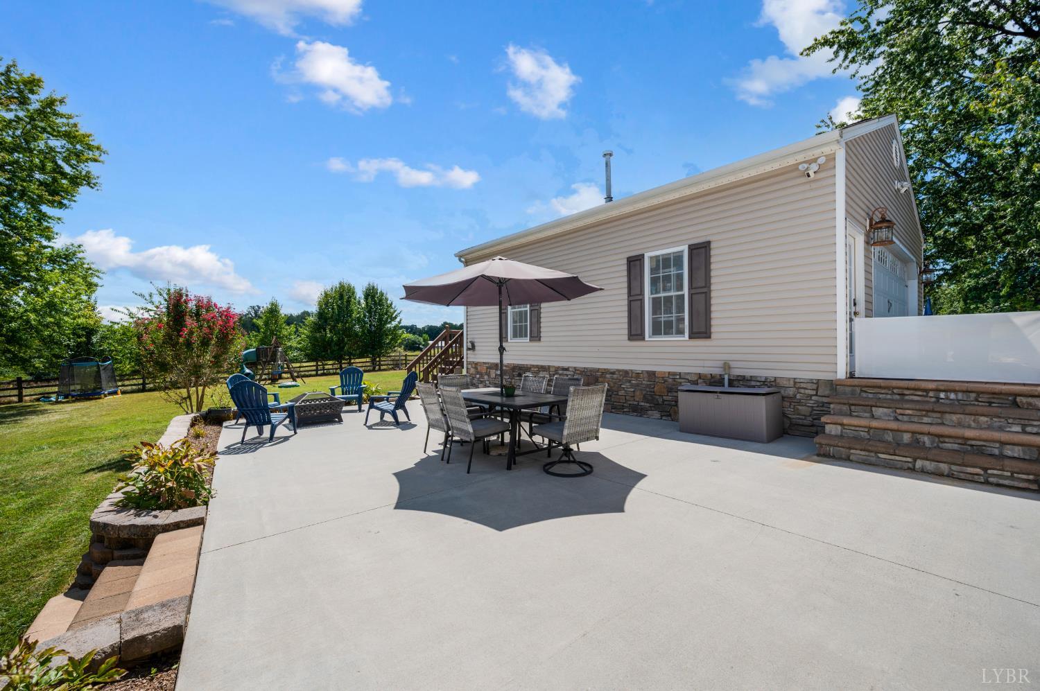 1199 Great Oak Road Forest, VA 24551 - Photo 56 of 85 a view of a patio with table and chairs and potted plants