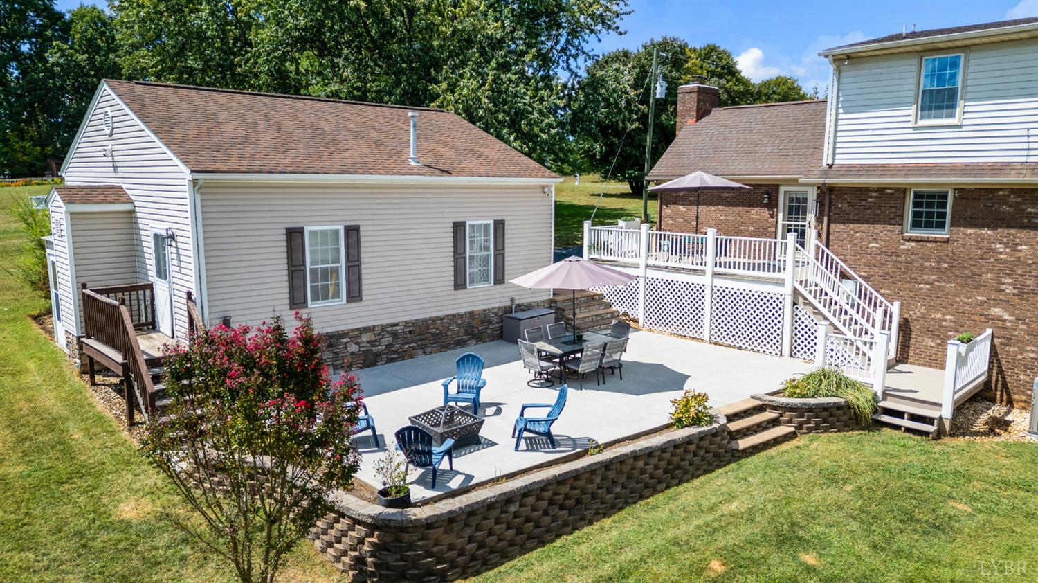 1199 Great Oak Road Forest, VA 24551 - Photo 64 of 85 a front view of house with yard outdoor seating and trees in the background