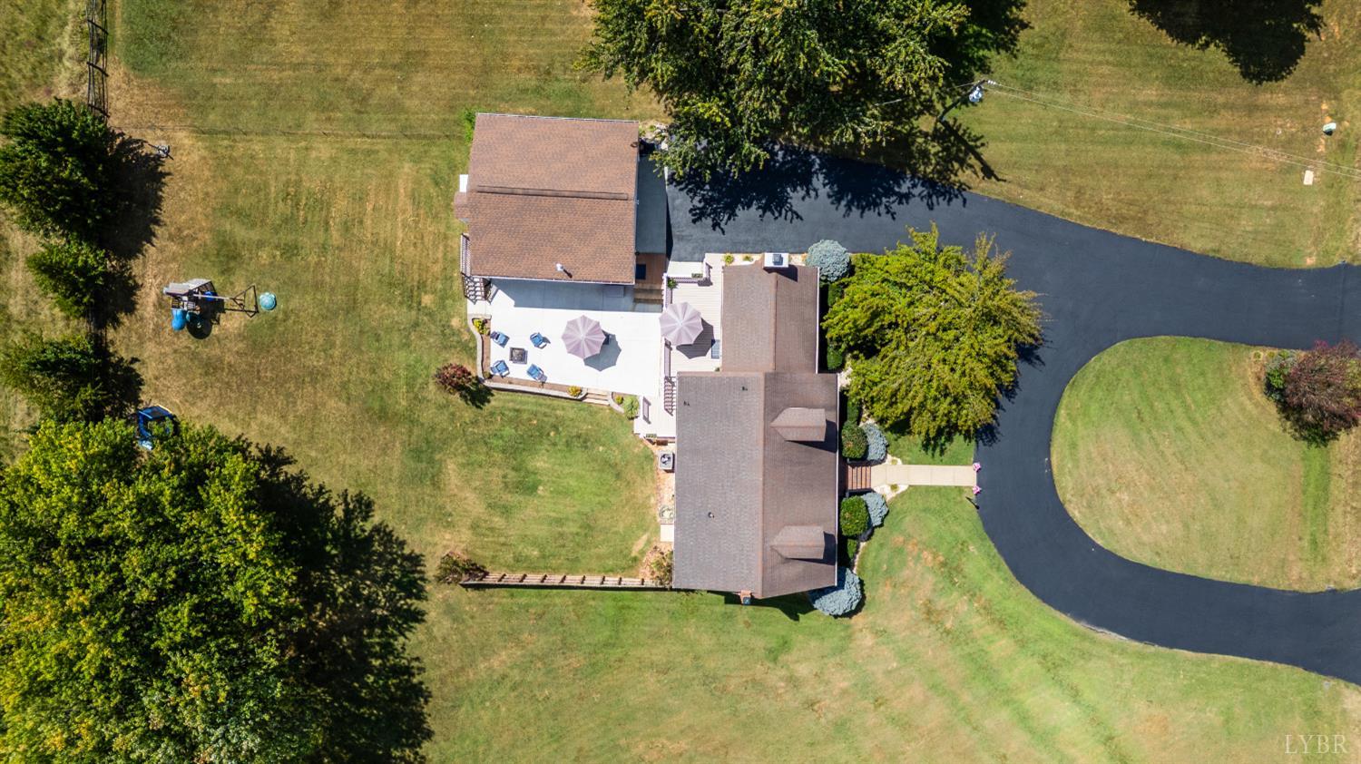 1199 Great Oak Road Forest, VA 24551 - Photo 74 of 85 an aerial view of a house with swimming pool and large trees