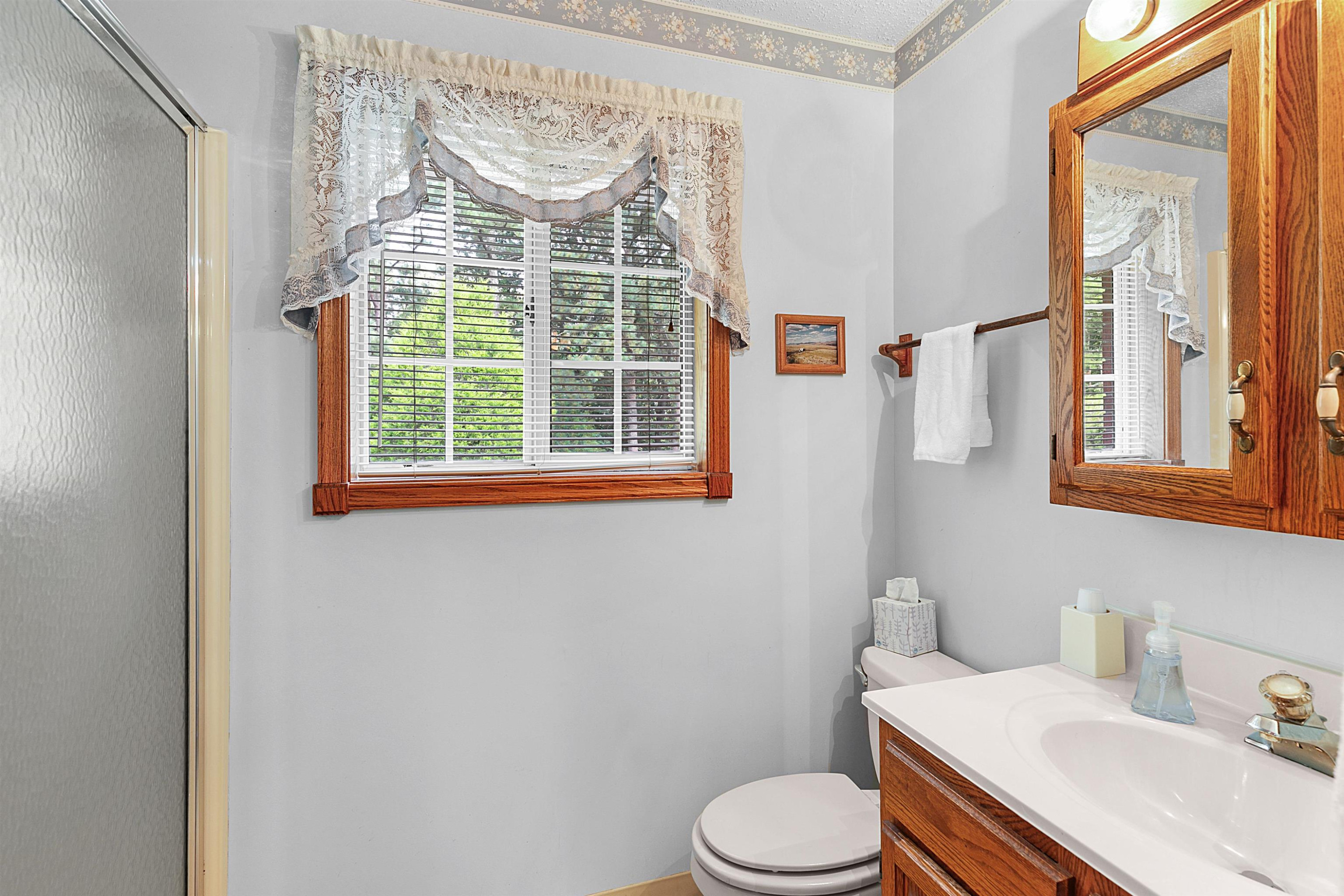 780 Griggs Chapel Road Cedar Grove, TN 38321 - Photo 17 of 25 a bathroom with a sink toilet and a mirror