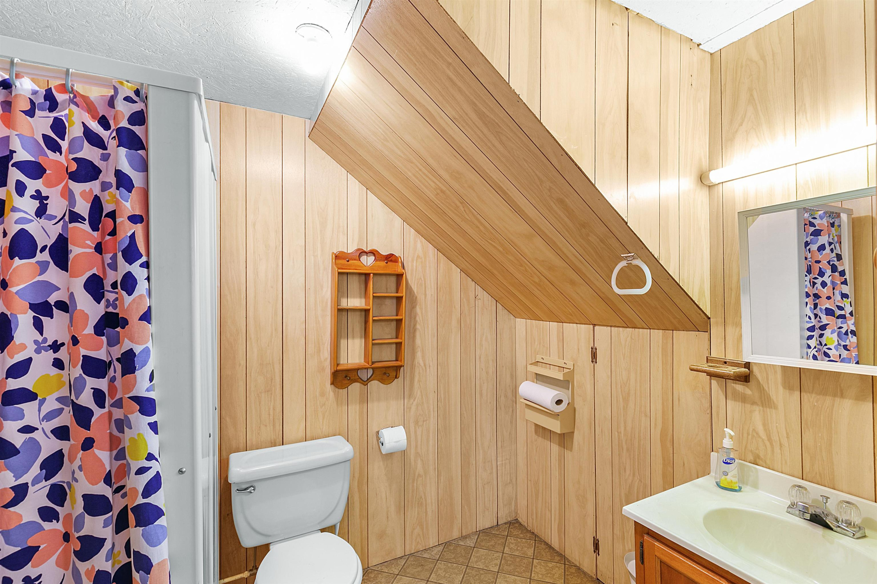 780 Griggs Chapel Road Cedar Grove, TN 38321 - Photo 18 of 25 a bathroom with a sink toilet and shower