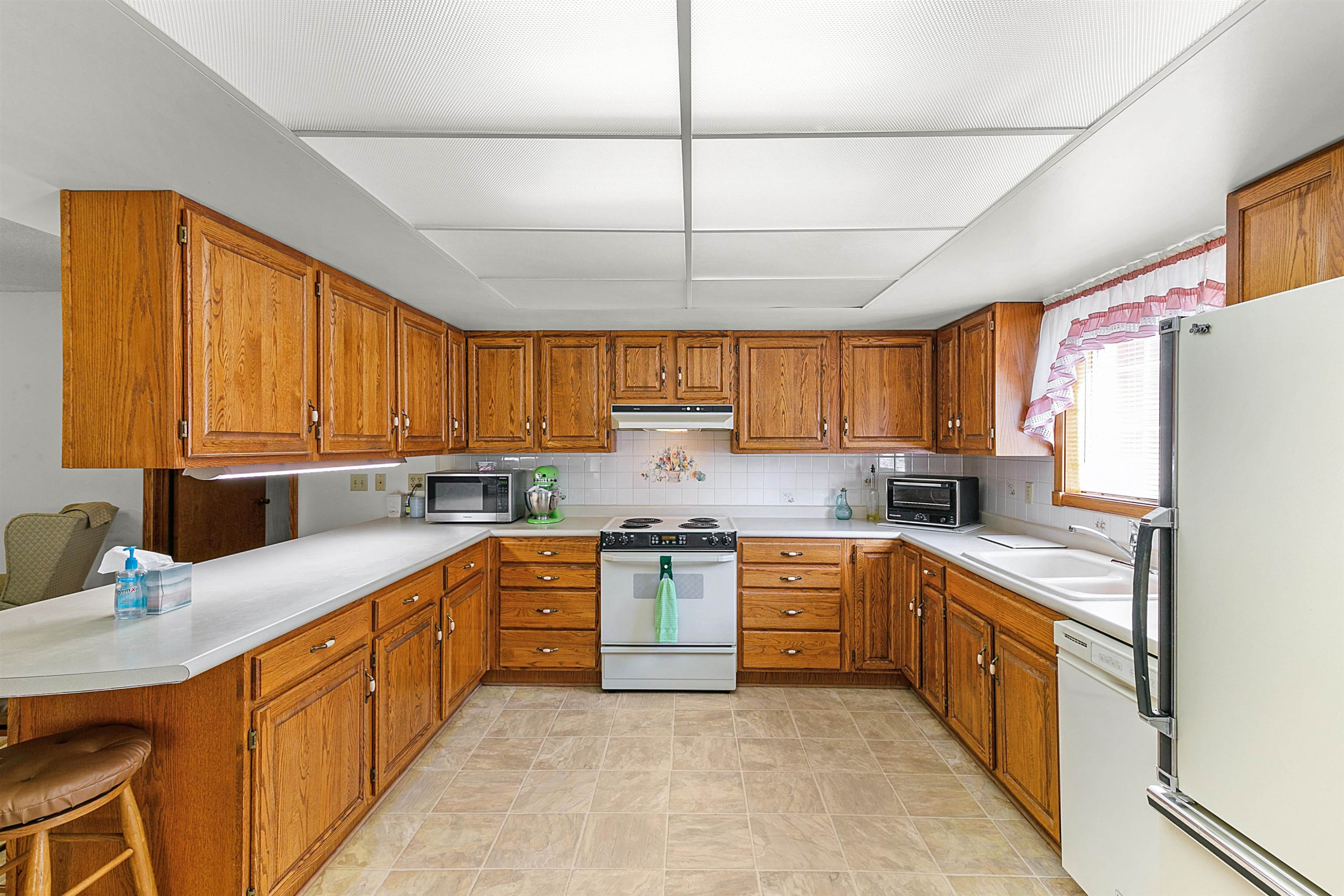 780 Griggs Chapel Road Cedar Grove, TN 38321 - Photo 5 of 25 a kitchen with stainless steel appliances granite countertop a sink window and cabinets