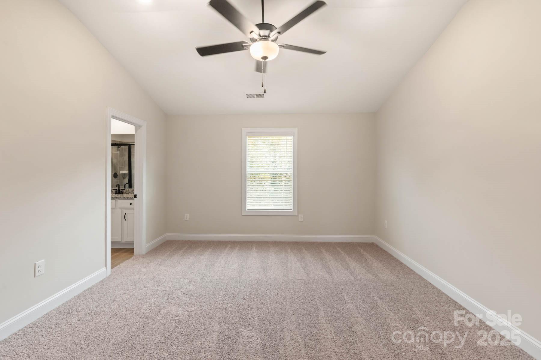 280 Limestone Terrace Mills River, NC 28759 - Photo 17 of 22 an empty room with a window and a ceiling fan