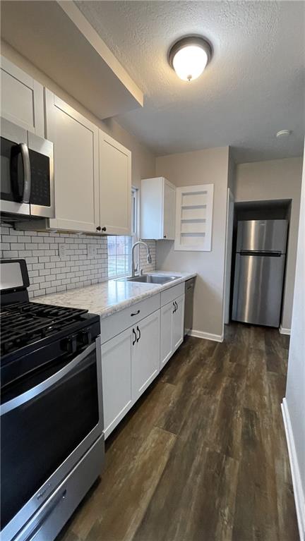 362 Navigation Street Beaver, PA 15009 - Photo 3 of 10 a kitchen with granite countertop a sink stove and refrigerator