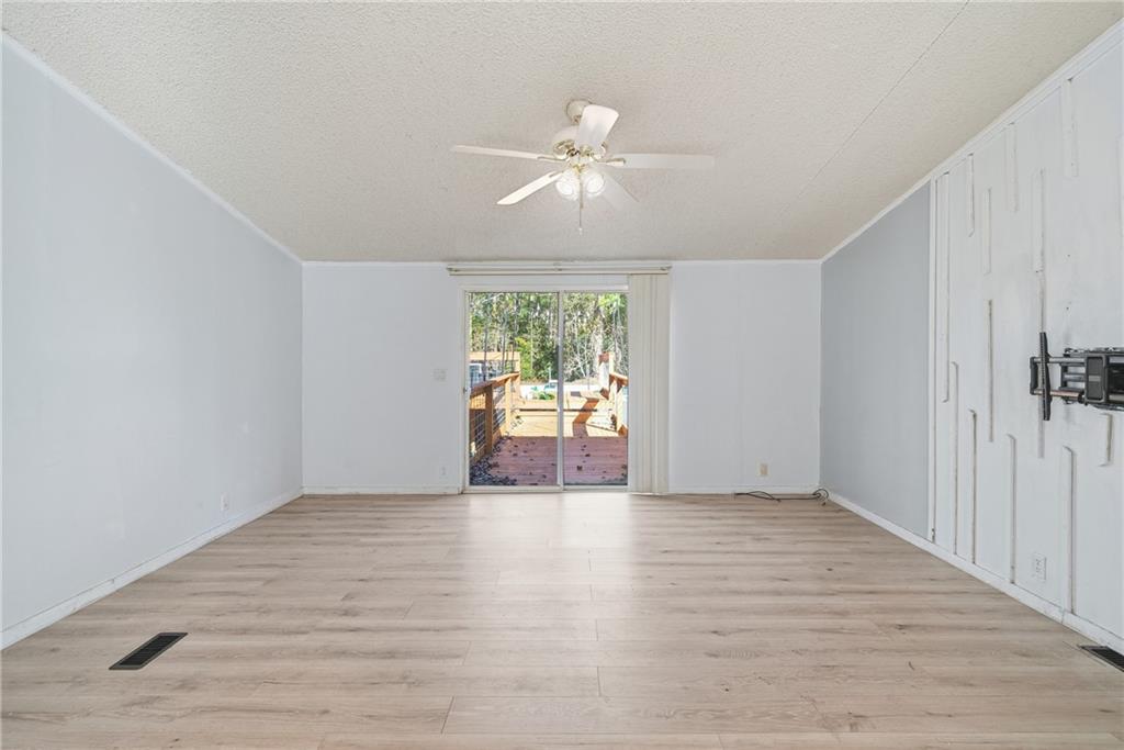 1265 Barfield Road Southwest Townsend, GA 31331 - Photo 14 of 30 wooden floor in an empty room with a window