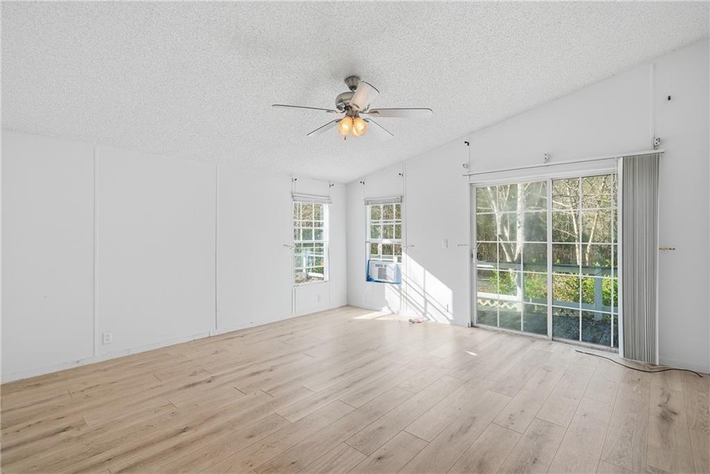 1265 Barfield Road Southwest Townsend, GA 31331 - Photo 16 of 30 wooden floor in an empty room with a window