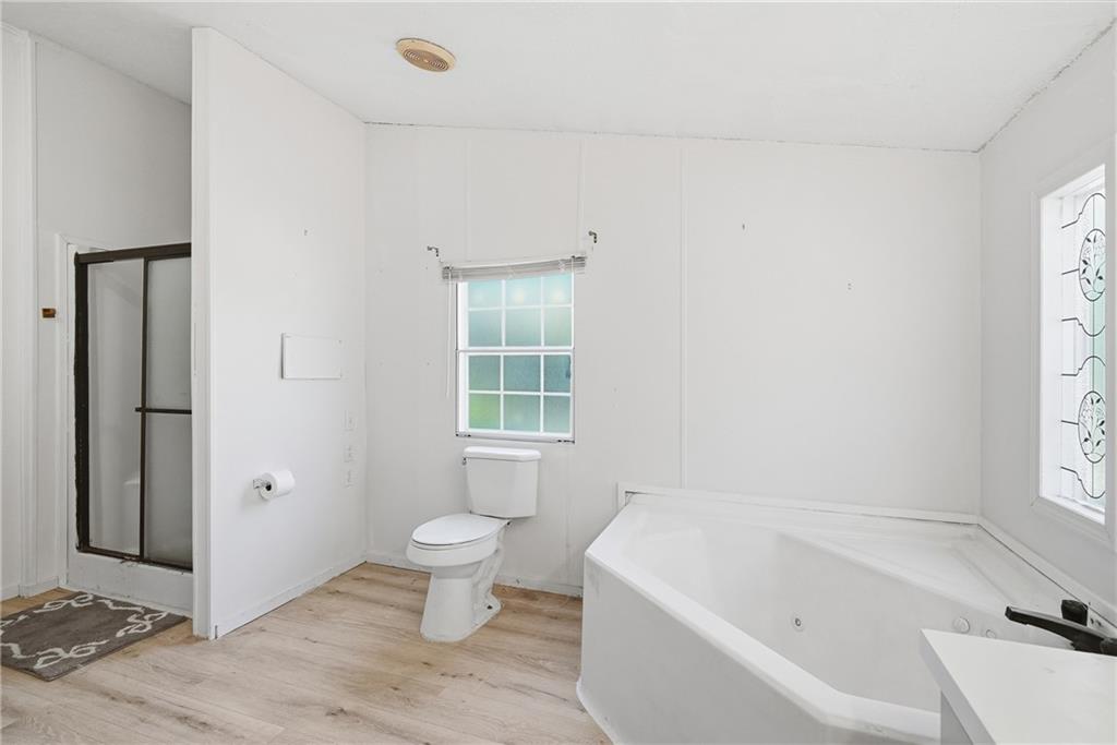1265 Barfield Road Southwest Townsend, GA 31331 - Photo 19 of 30 a bathroom with a bathtub and window