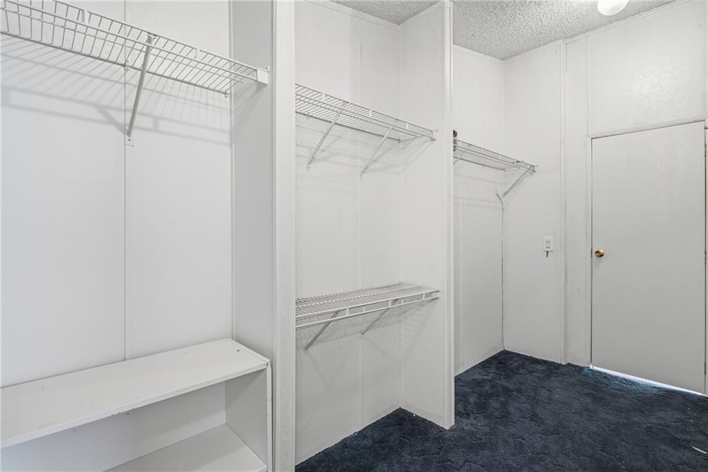 1265 Barfield Road Southwest Townsend, GA 31331 - Photo 21 of 30 a view of walk in closet with empty racks