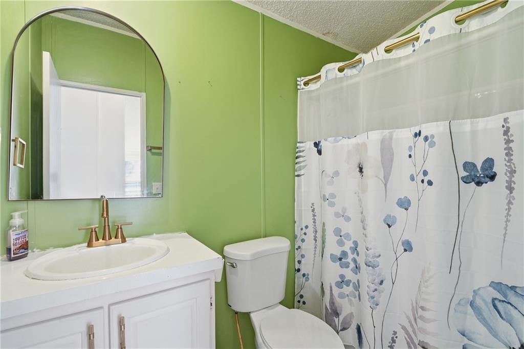 1265 Barfield Road Southwest Townsend, GA 31331 - Photo 24 of 30 a bathroom with a sink toilet and shower