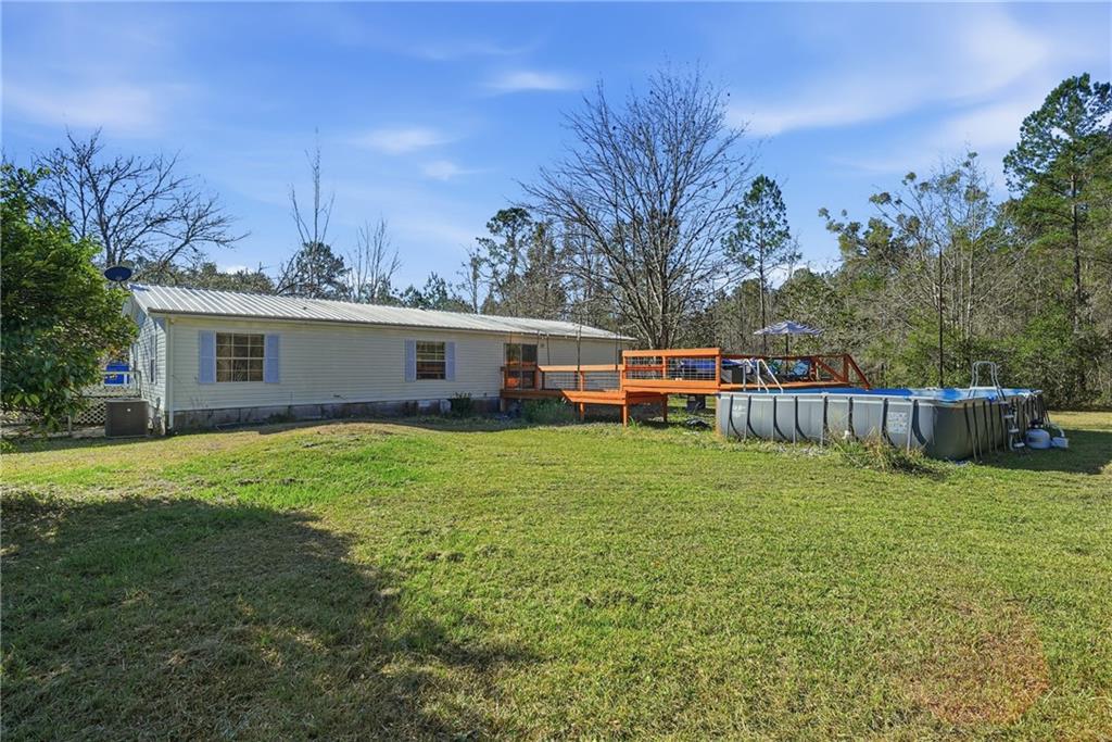 1265 Barfield Road Southwest Townsend, GA 31331 - Photo 25 of 30 a view of a house with backyard and sitting area