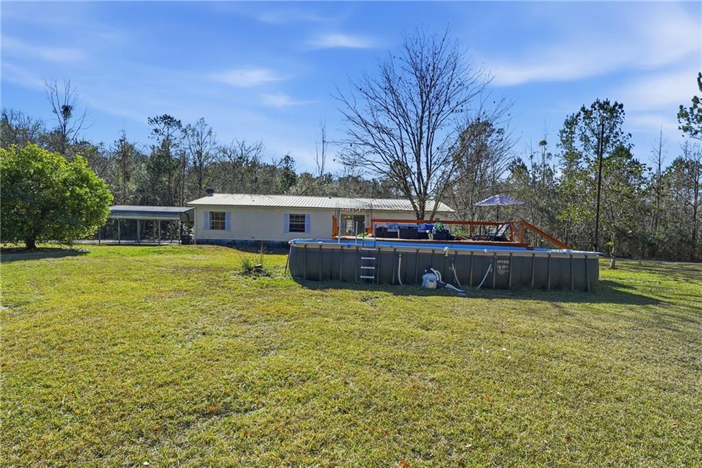 1265 Barfield Road Southwest Townsend, GA 31331 - Photo 26 of 30 a view of a house with a yard and sitting area