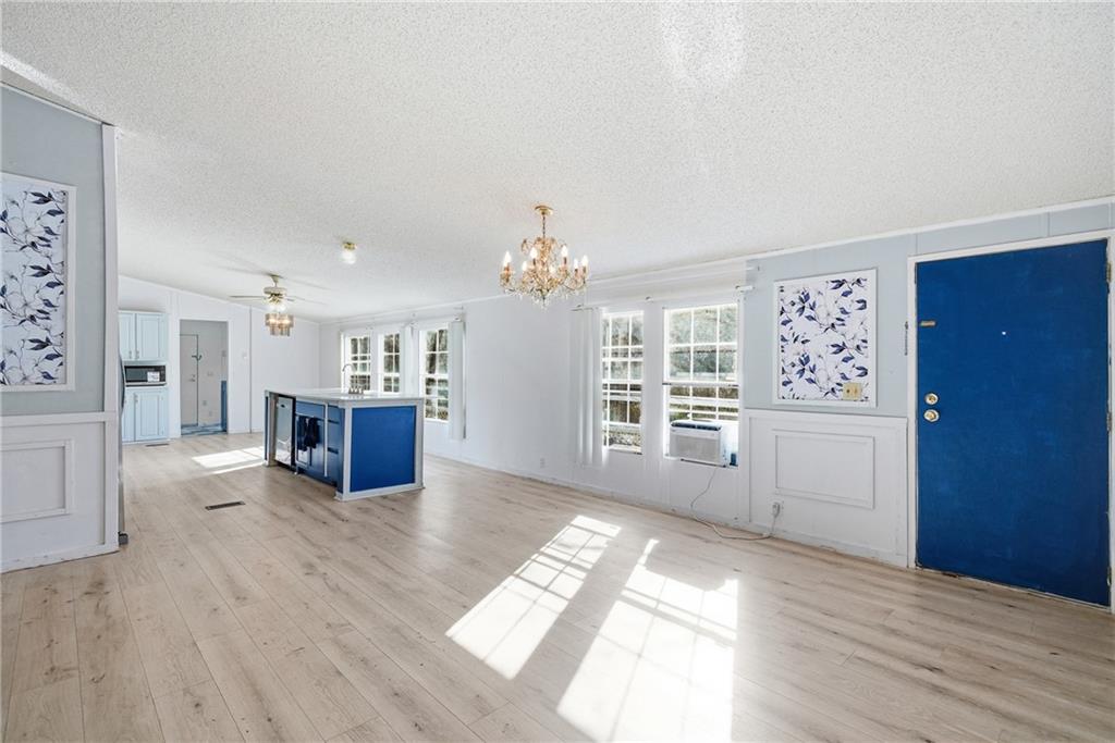 1265 Barfield Road Southwest Townsend, GA 31331 - Photo 6 of 30 a view of a kitchen with furniture and wooden floor