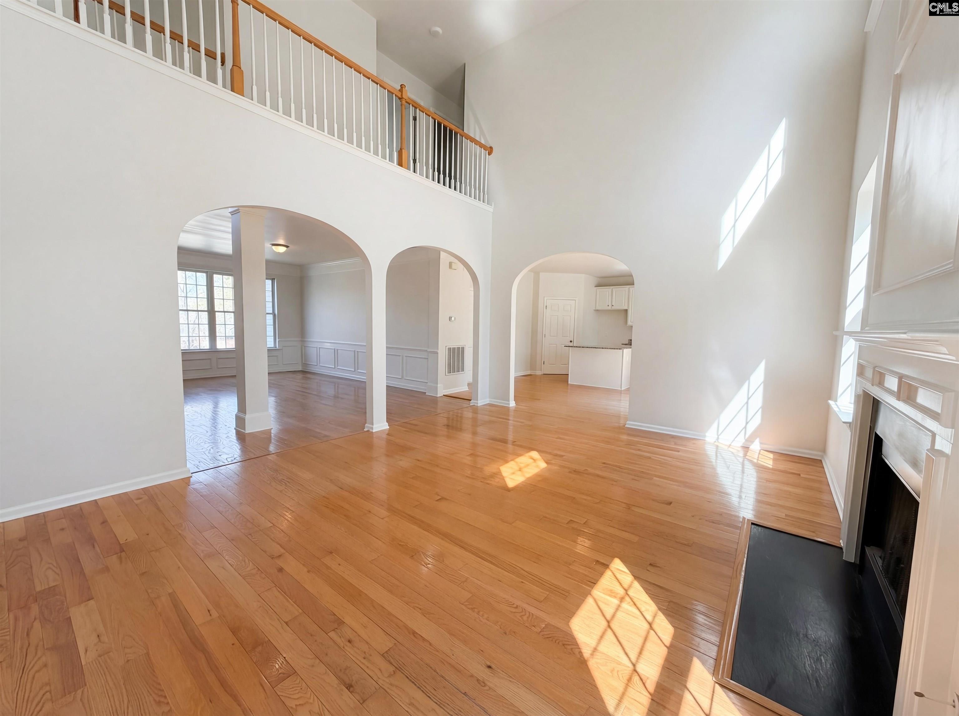 112 Coopers Hawk Circle Irmo, SC 29063 - Photo 17 of 26 a view of empty room with fireplace and wooden floor