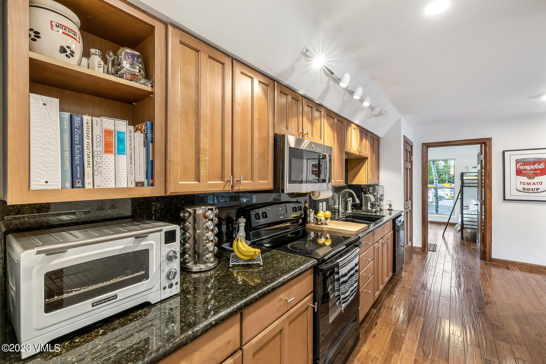 16 Eagle-Vail Road, Unit A1 Eagle-Vail, CO 81620 - Photo 15 of 30 a kitchen with stainless steel appliances granite countertop a stove a sink and a microwave