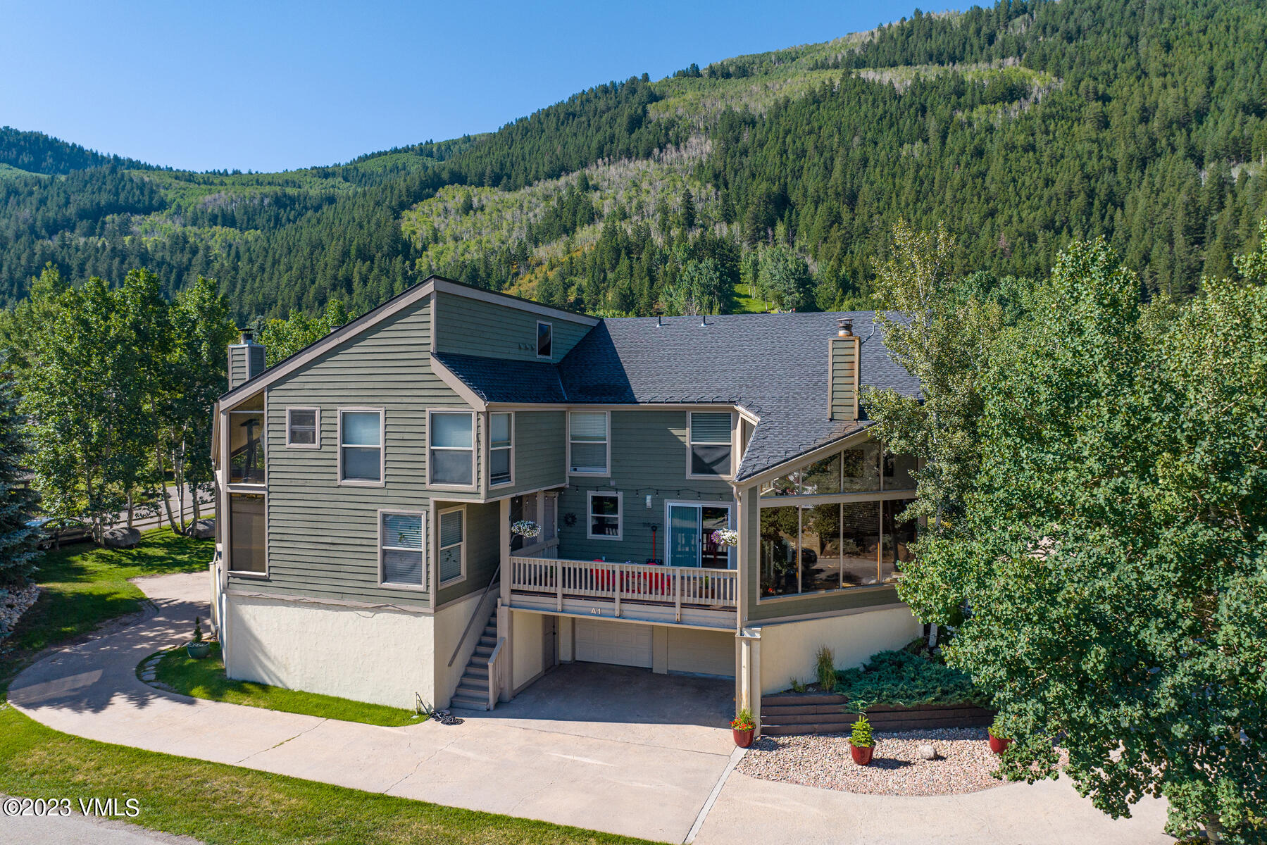 16 Eagle-Vail Road, Unit A1 Eagle-Vail, CO 81620 - Photo 2 of 30 a front view of a house with a yard