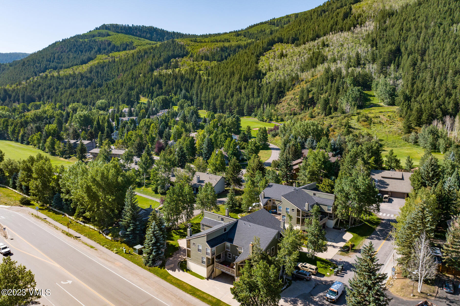 16 Eagle-Vail Road, Unit A1 Eagle-Vail, CO 81620 - Photo 3 of 30 an aerial view of residential houses with outdoor space and trees