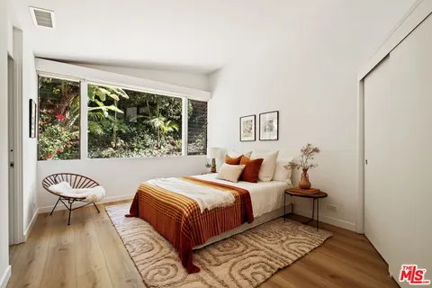 a outdoor living space with furniture and city view