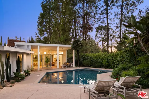 a swimming pool view with a lake view