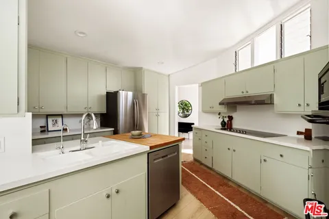 a bedroom with a bed and couch