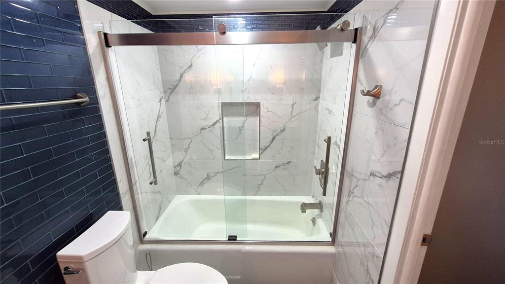 2611 Bayshore Boulevard, Unit 806 Tampa, FL 33629 - Photo 14 of 35 a bathroom with a bathtub and a shower