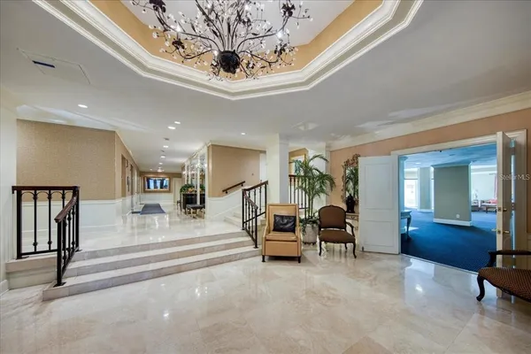 a view of a hallway with seating area