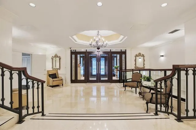 a view of a livingroom with furniture and staircase