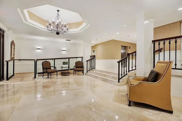 a view of a livingroom with furniture and lots of furniture