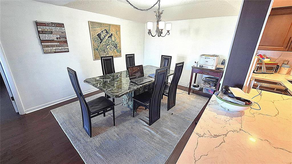 2611 Bayshore Boulevard, Unit 806 Tampa, FL 33629 - Photo 9 of 35 a view of a dining room with furniture window and wooden floor