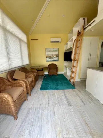 a kitchen with a refrigerator and a stove top oven